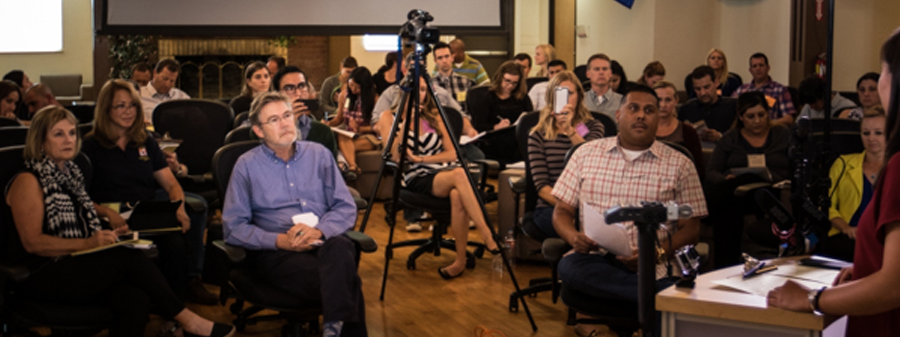 CSTI Advanced PIO Course - Students sit as audience watching someone playing role as PIO